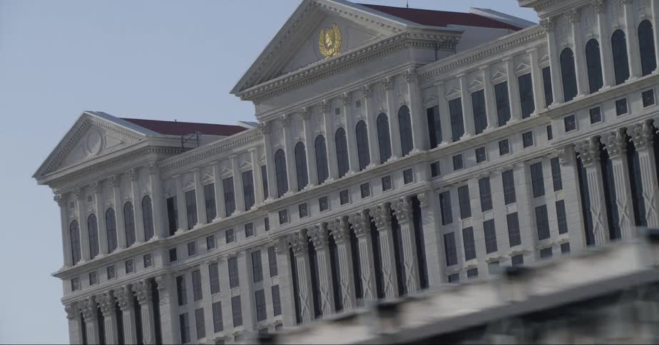 Twisting footage of the caesars palace hotel and casino facade in las vegas