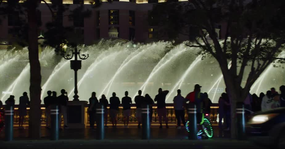 Tourists viewing a large fountain in las vegas