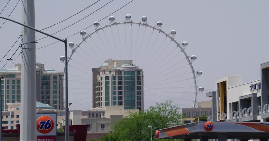Exterior view of ferris wheel and apartment buildings in the city