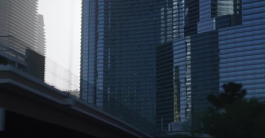 The smog is between the tall buildings