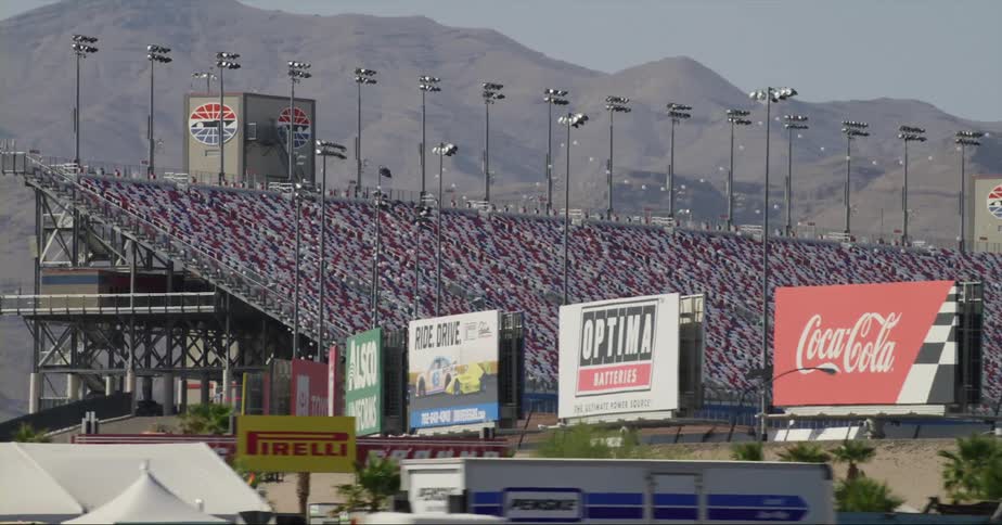 Large crowd filling the seats of an outdoors stadium in las vegas