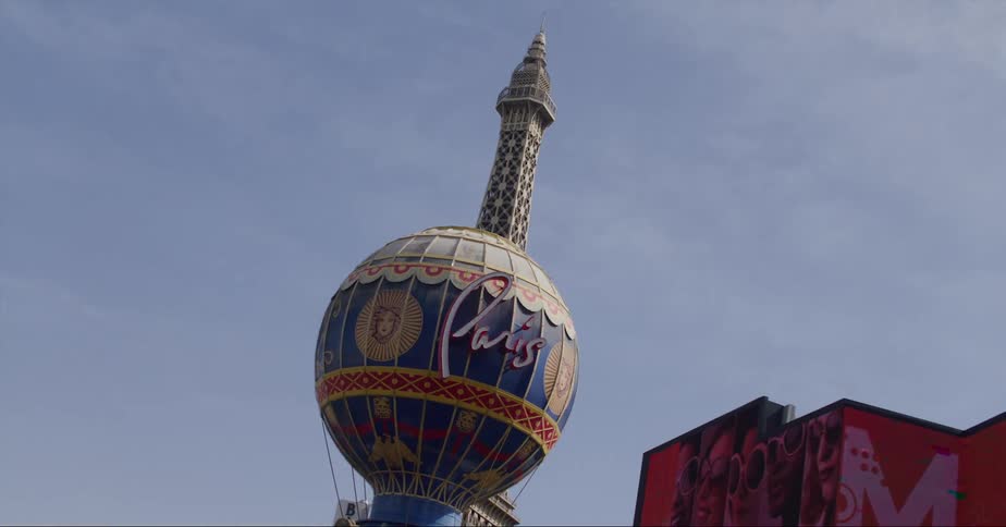Large outdoor digital signs and an eiffel tower replica amongst other items decorate las vegas strip