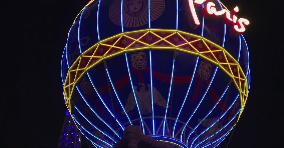 Driving past the paris casino sign on the lasvegas strip at night