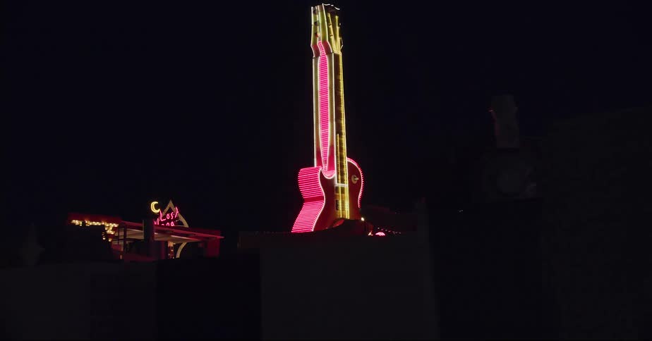 The giant hard rock cafe guitar ligthed at night in las vegas
