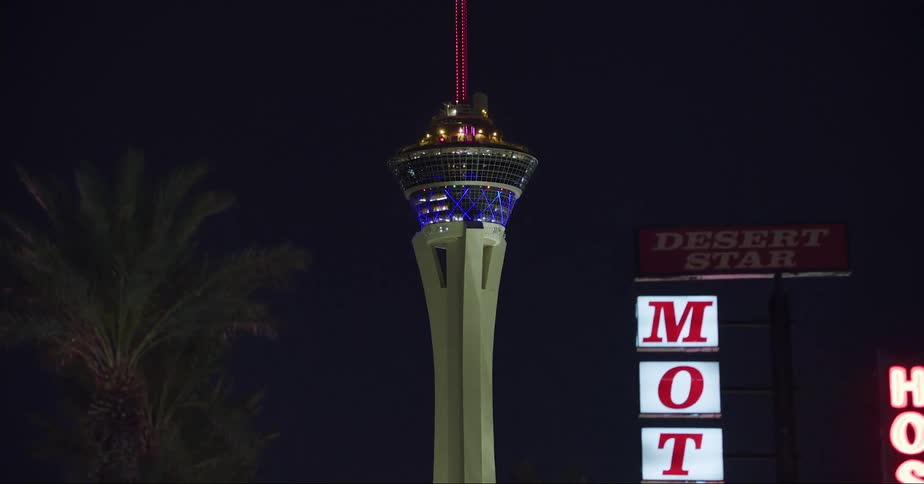 The tower is flashing lights in the night sky
