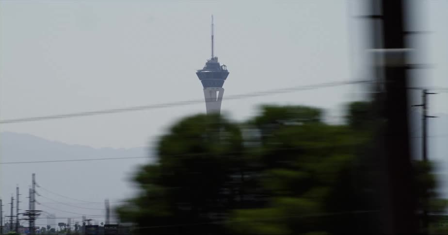 A tall tower is in the middle of the city