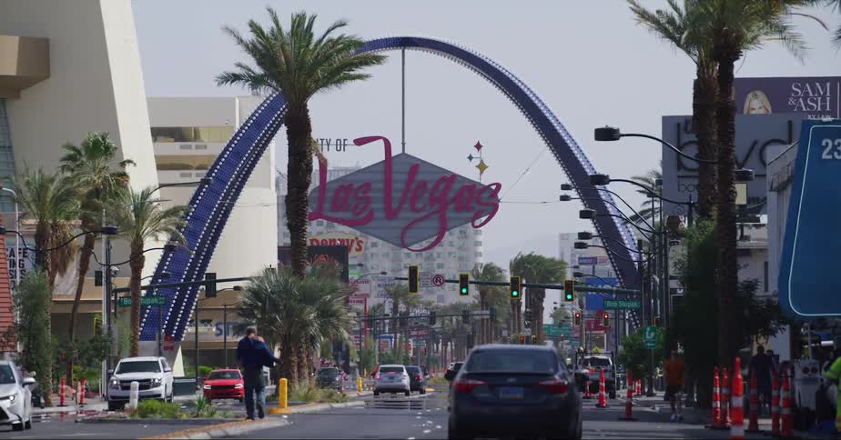 Pedestrians and traffic moves along las vegas street near road construction