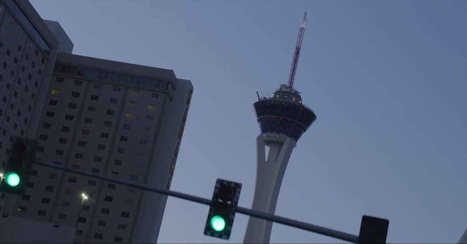 The space needle next to a high rise hotel