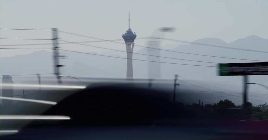 The stratosphere tower in las vegas seen from a moving vehicle at daytime