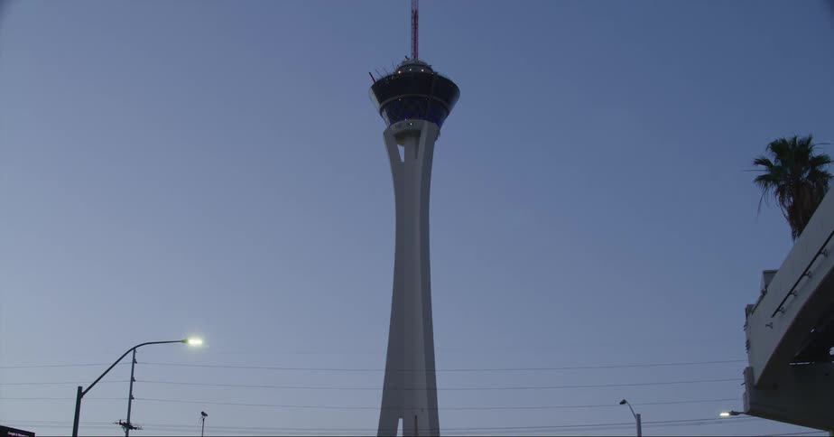 Exterior view of the strat tower and resort at dusk
