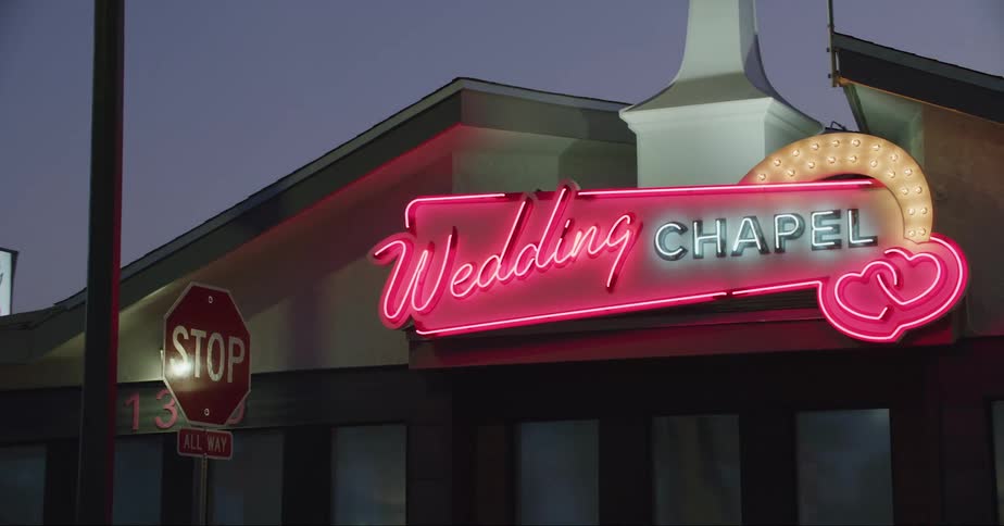 The illuminated sign of a wedding chapel in las vegas at night
