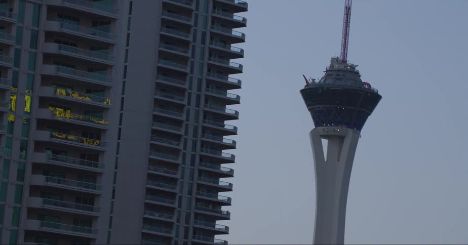 A tall tower in a metropolis during the day