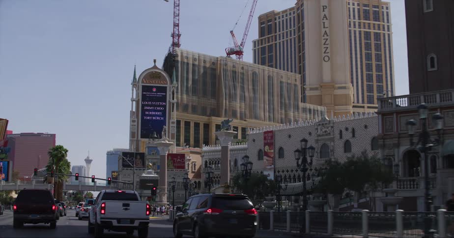 Pov driving on the las vegas strip towards the stratosphere on a clear day