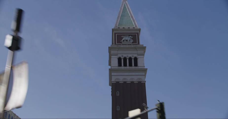Narrow tower stands near street in las vegas near casinos and hotels