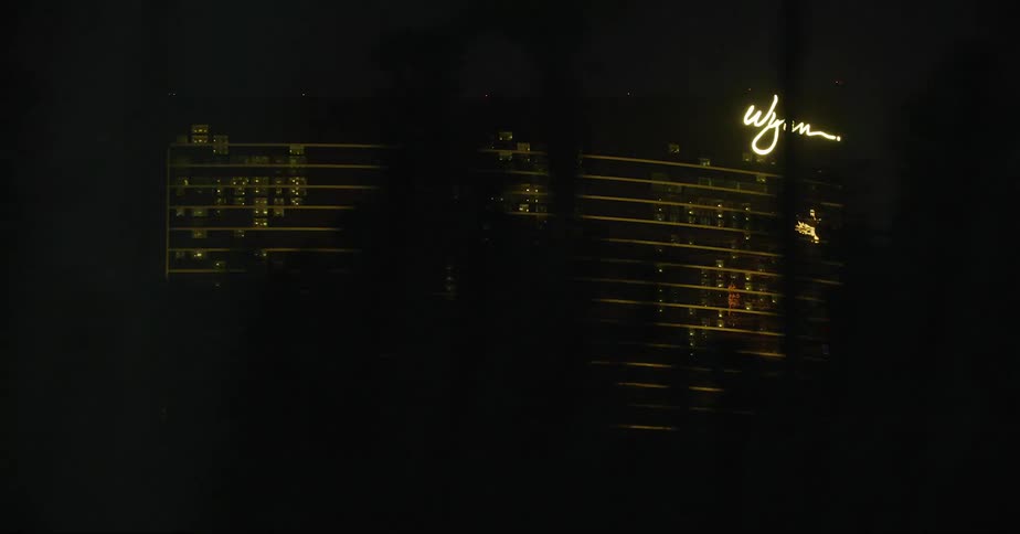 Driving by wynn hotel on the strip in las vegas at night