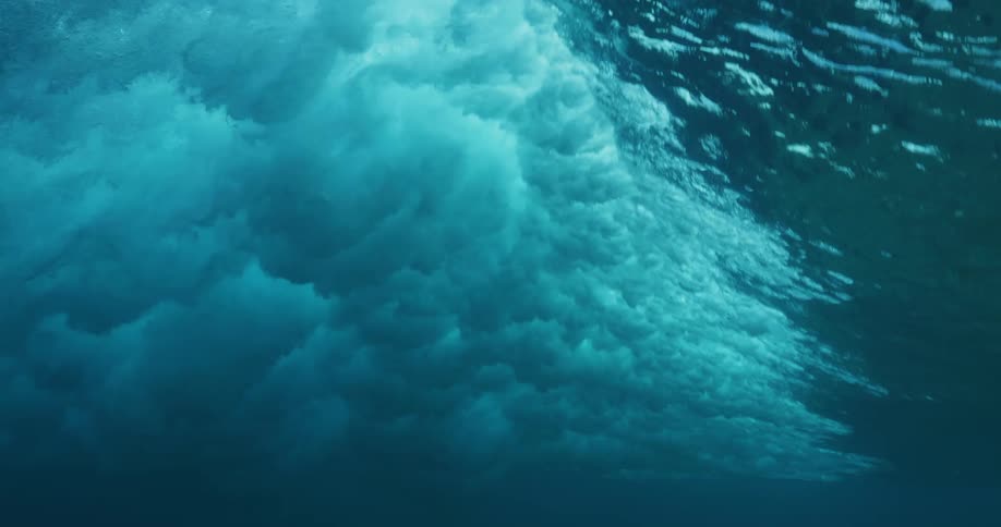 Ocean wave moves across the surface of water