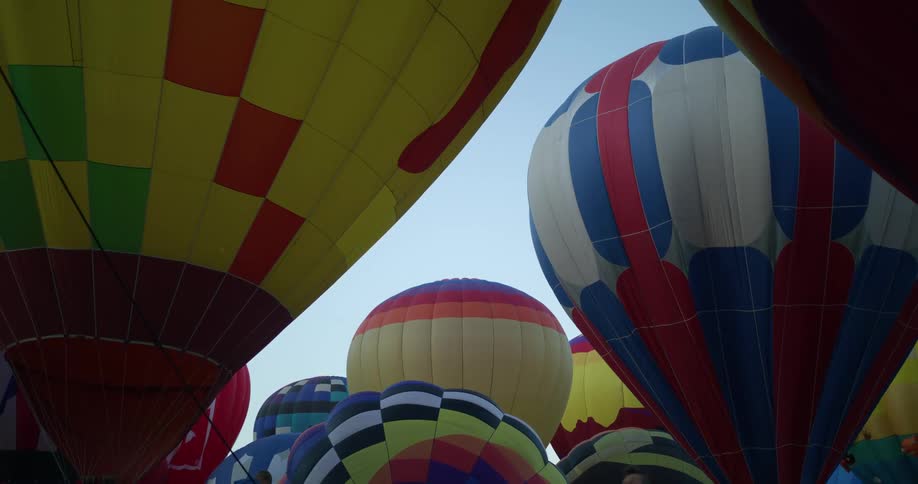 A group of hot air balloons outdoors during the day