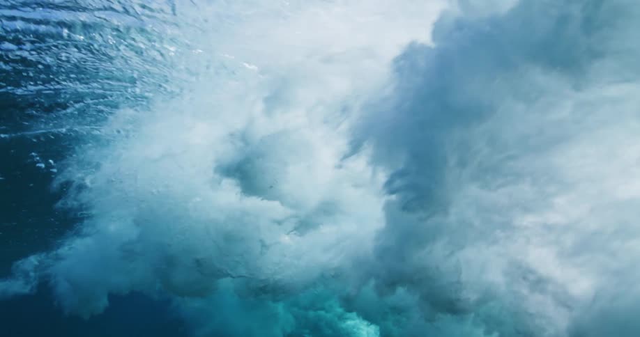 Underwater view of wave crashing in the ocean