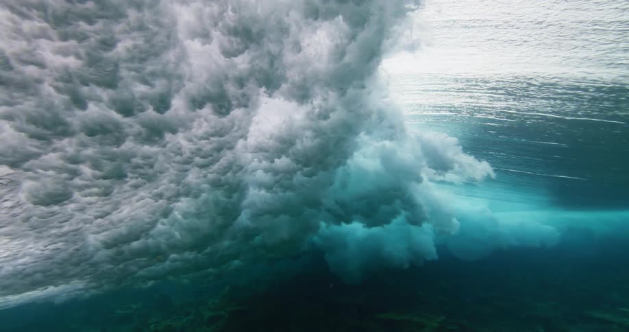 Ocean wave moves across the surface of water