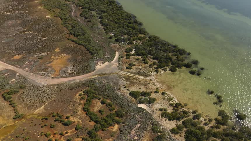 Birds eye view of the ocean and coast is displayed