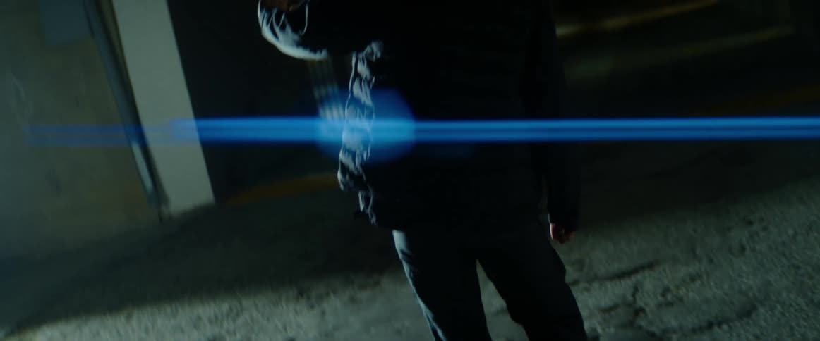 Man walking on a dark alley gets blinded by a bright light
