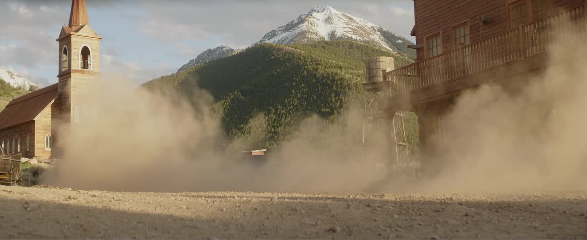 A car speeds out of the small town