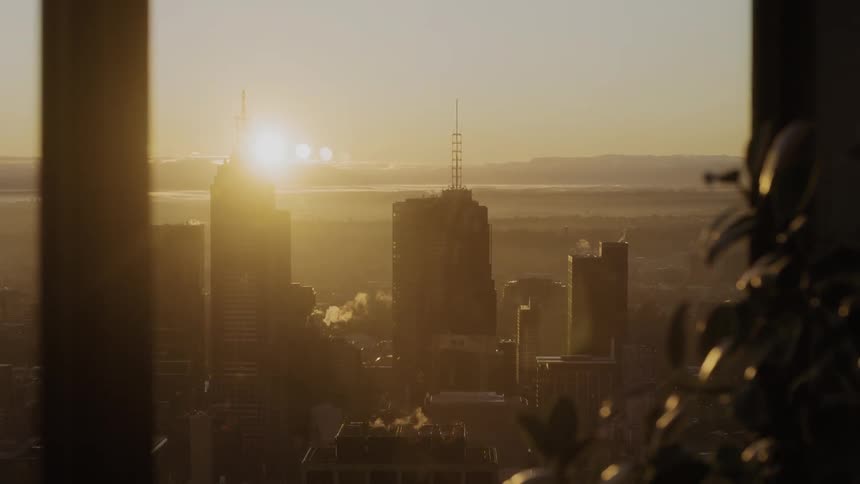 The sun is setting behind this city