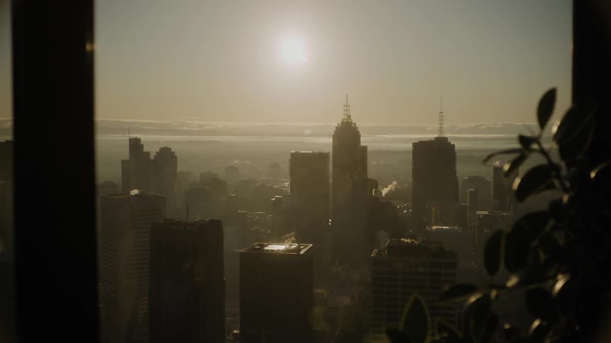 The sun over a foggy city