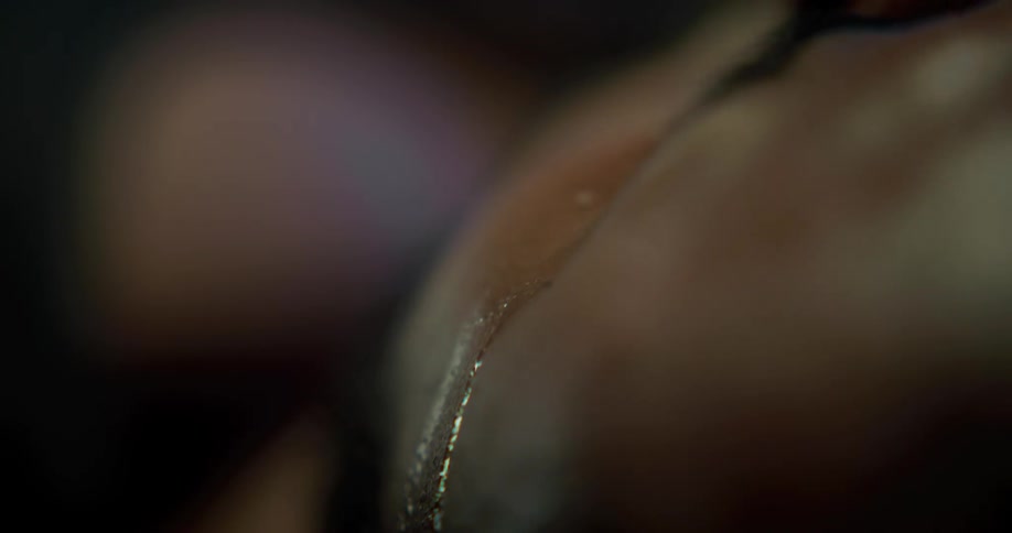 Water drips down the back of a persons hand
