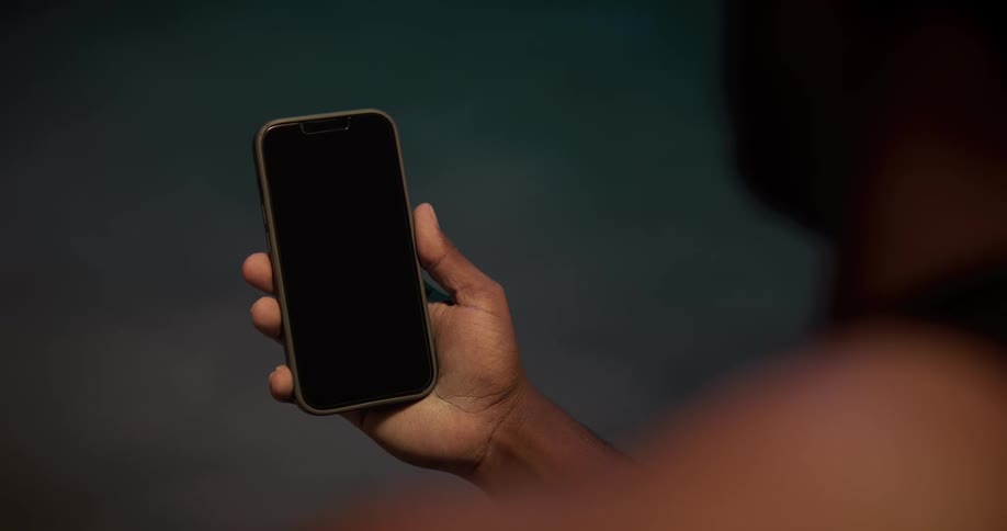 Close up of a man holding a smartphone in his hand