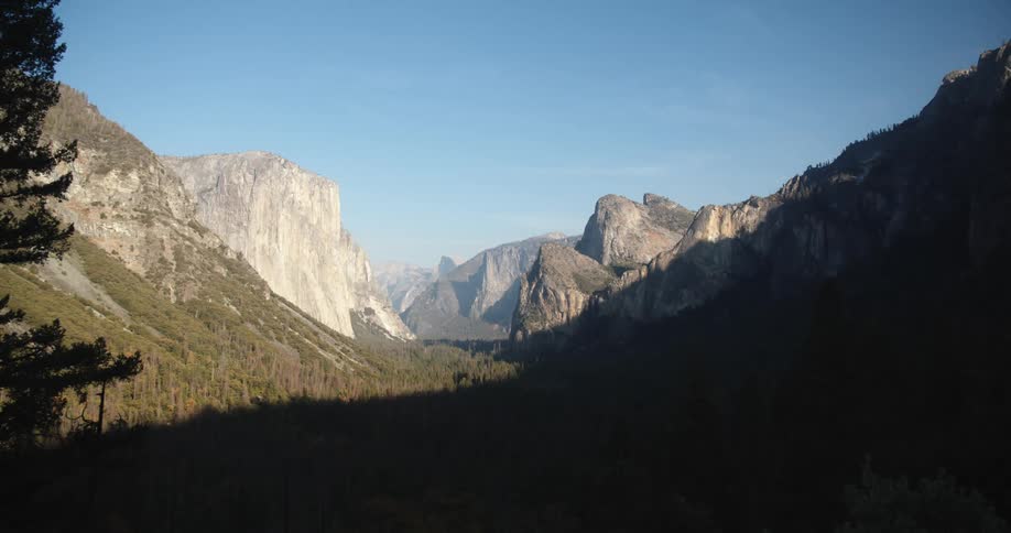 Steep cliffs and tall peaks fill a canyon
