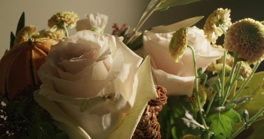 White roses sit front and center in a bouquet
