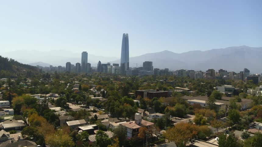 Gran Torre Santiago looms over a neighboorhood