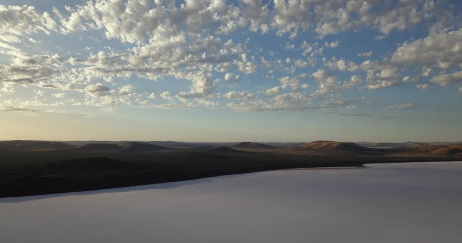A frozen lake lines the shore