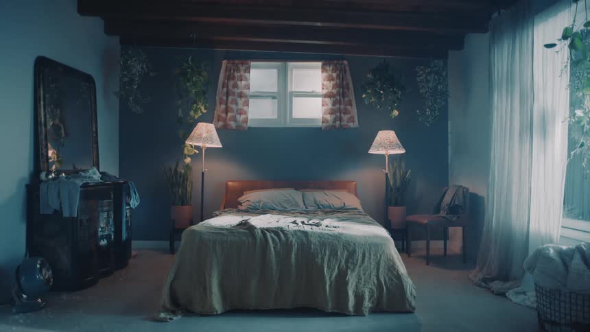 An empty bed in a bedroom in a home
