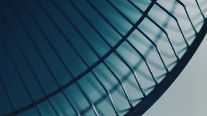 A fan blade is spinning in its cage