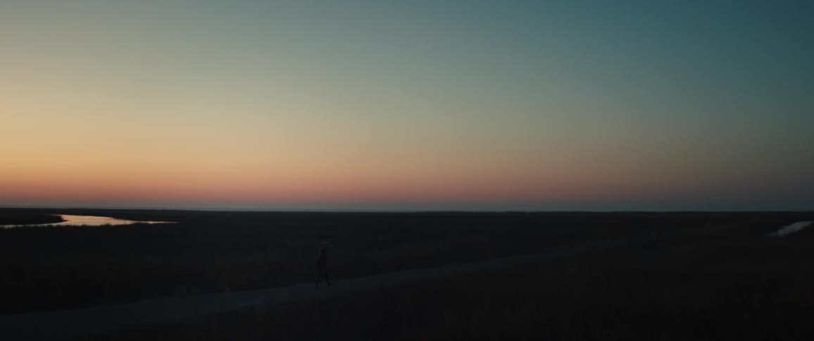 Walking on a road on the plains at sunset