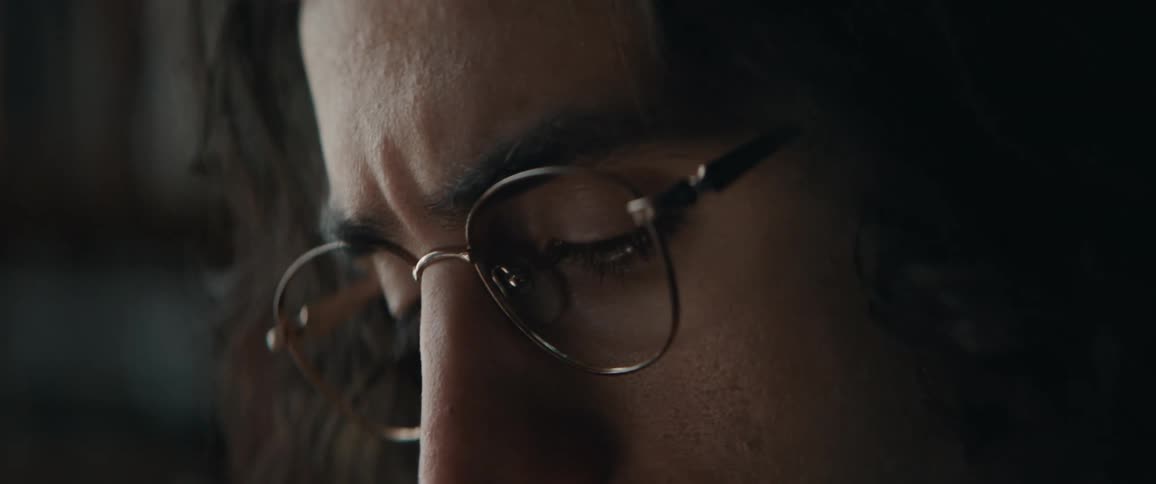 Close up view of a man wearing glasses