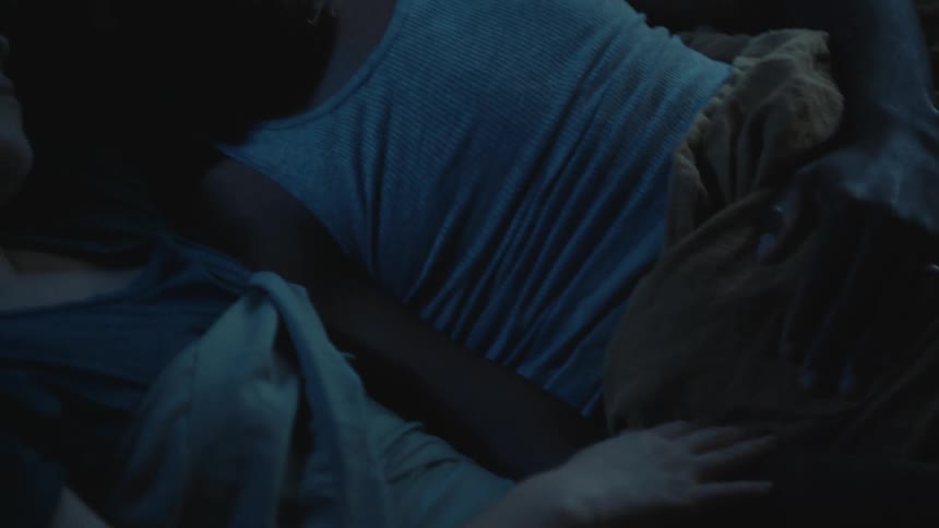 A couple sleeping side by side with heads together and arms touching