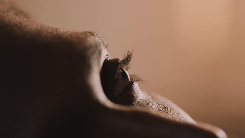 Sleeping man wakes up and turns his head
