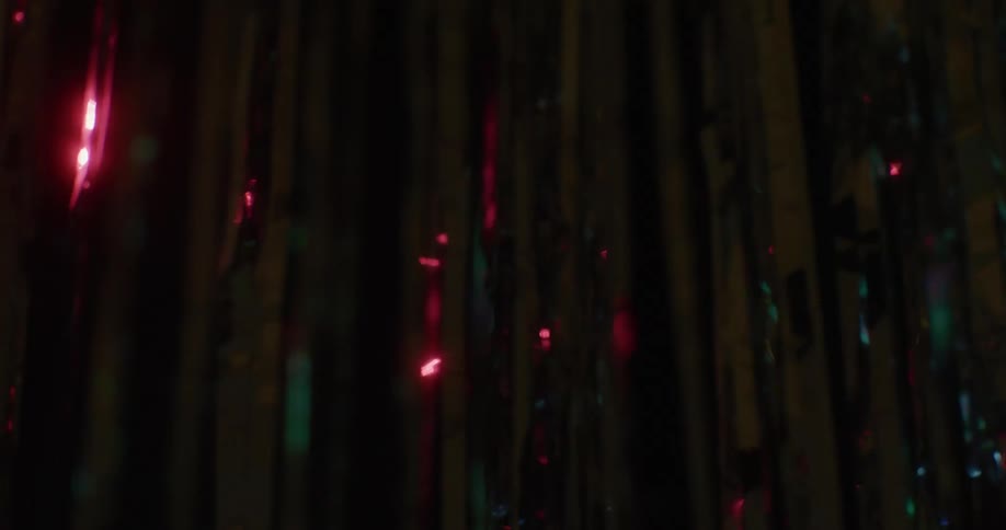 Lights shine on decorative streamers indoors