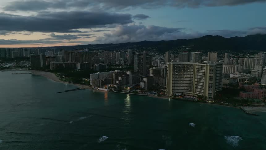 Large buildings on the coast of a metropolis at sunset