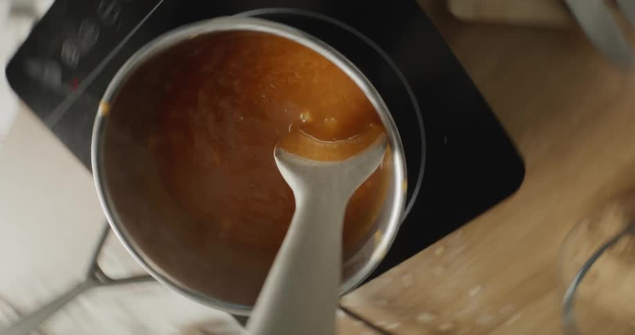 Caramel is stirred in a pot