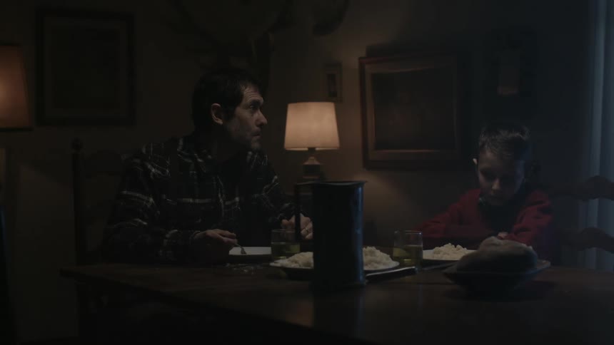 A father and son in a room together