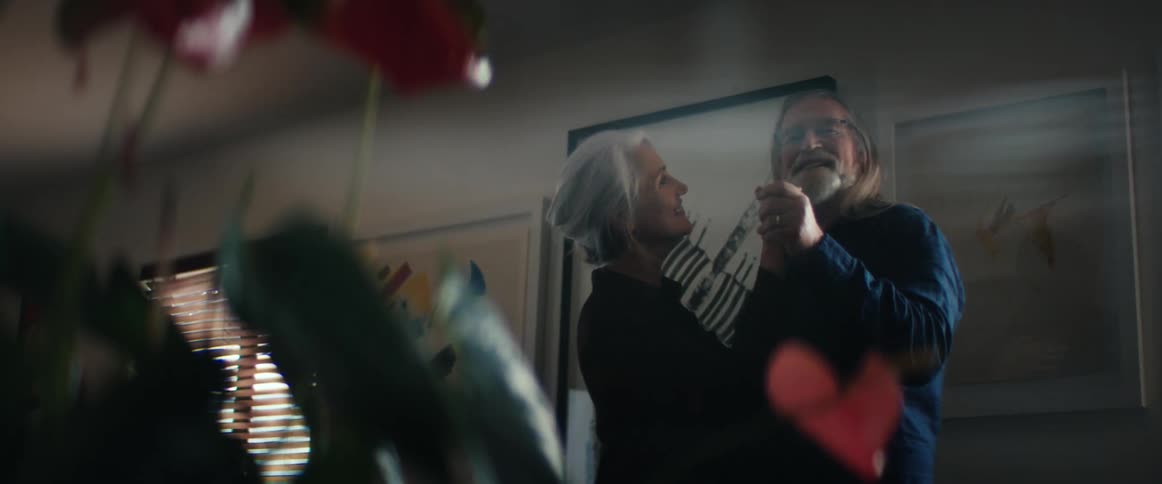 A man and woman dancing in a room