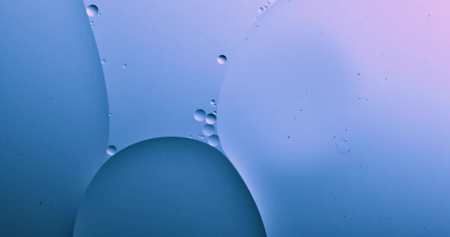 Abstract oil moves across the surface of water