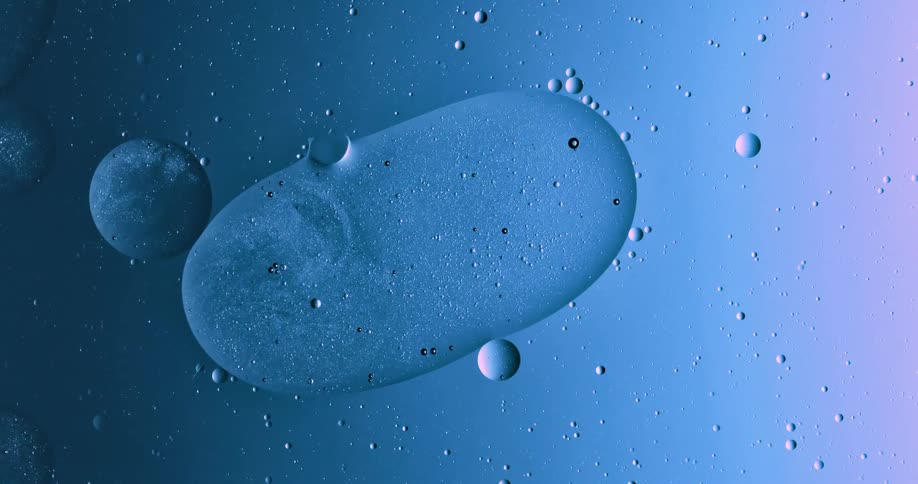 Oil moves across the surface of water