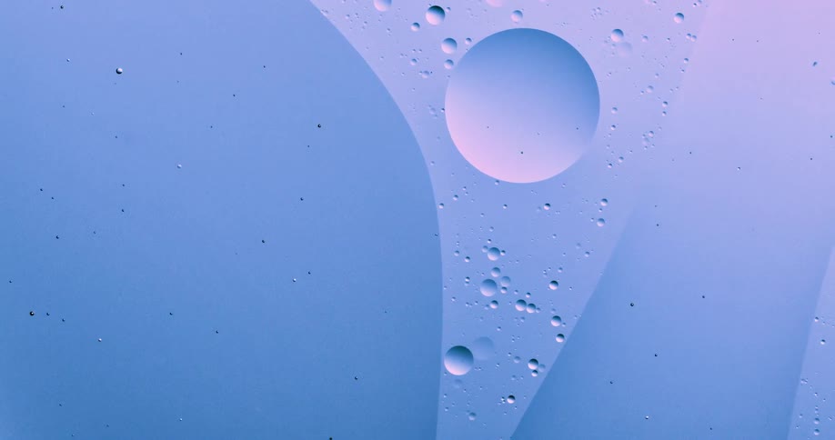 Oil moves on the surface of the water