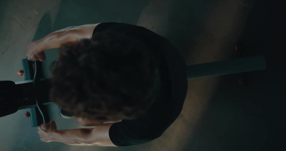 View from above as a man is working out on an exercise machine