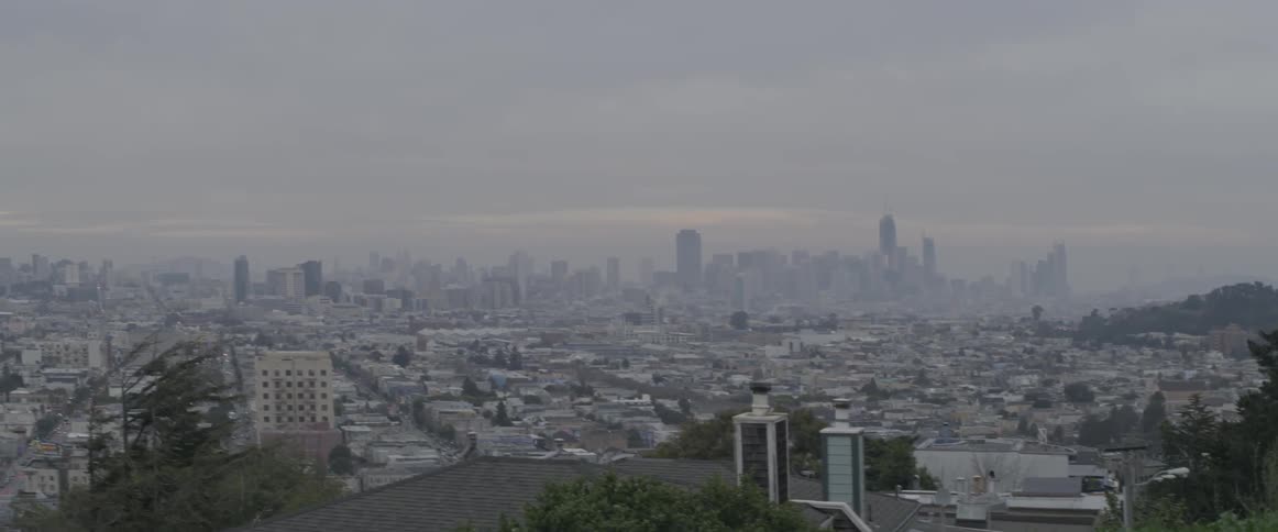 Dark clouds clinging to a city skyline
